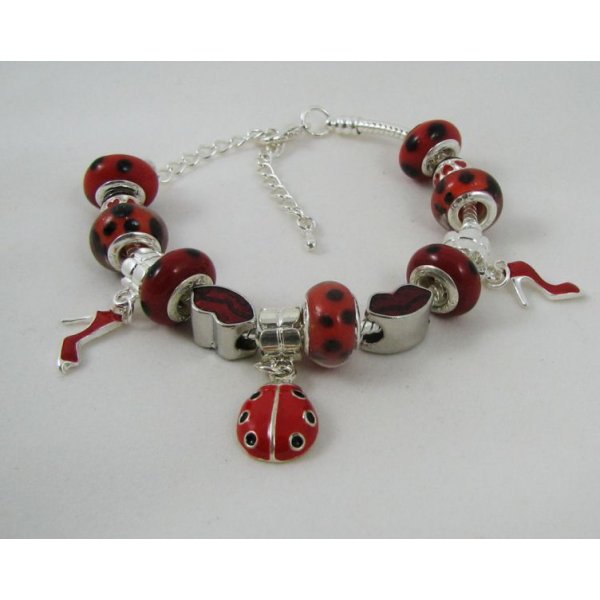 Silver bracelet with red ladybug beads