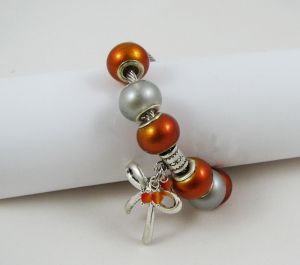 Silver bracelet with orange beads and knot