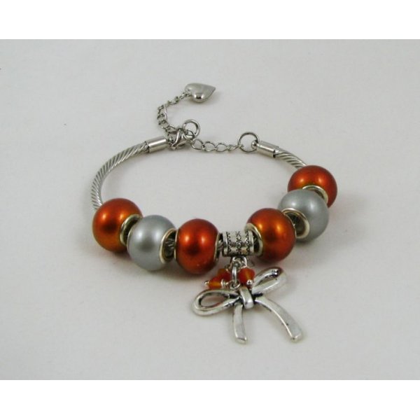 Silver bracelet with orange beads and knot