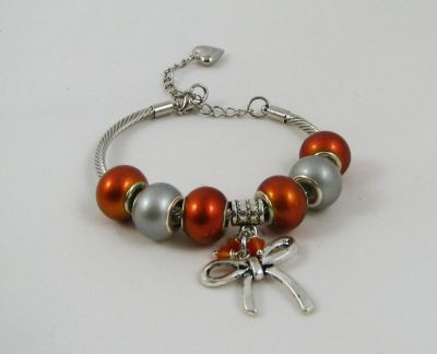 Silver bracelet with orange beads and knot