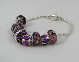 Silver bracelet with purple pearls and rhinestones