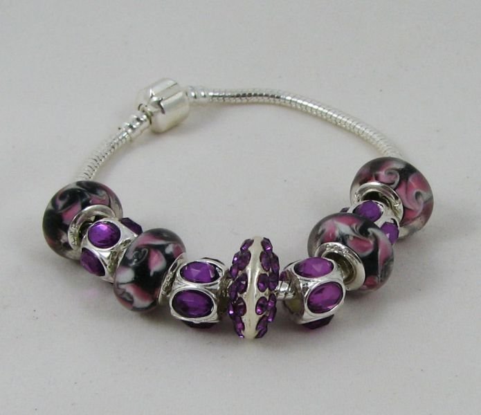 Silver bracelet with purple pearls and rhinestones