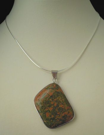 Cabochon pendant set in unakite stone 