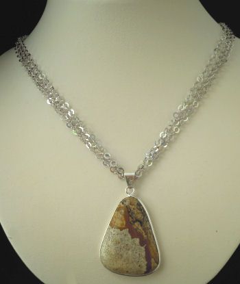 Cabochon pendant set in landscape jasper stone triangular shape