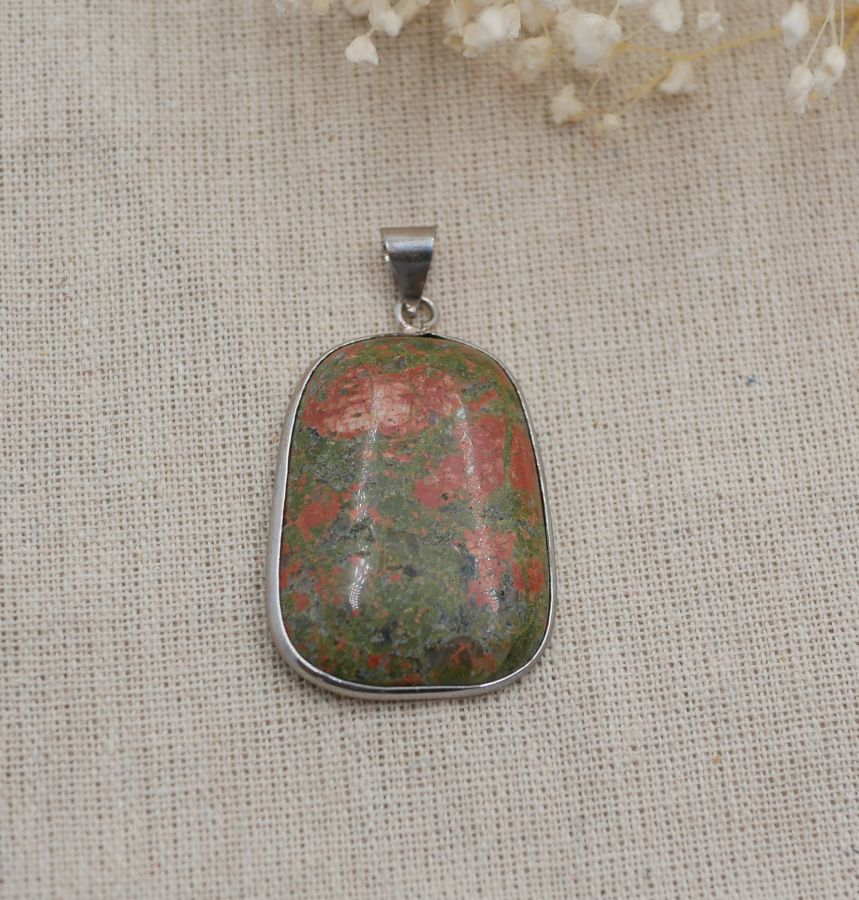 Cabochon pendant set in unakite stone round rectangular shape