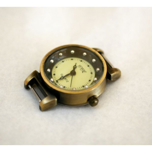 Black and bronze watch face with springs