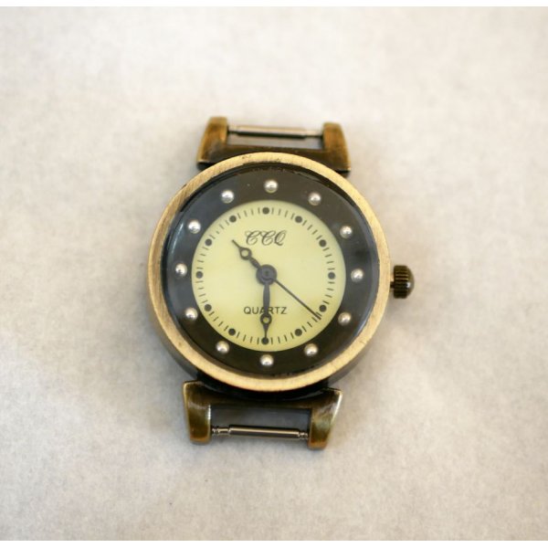 Black and bronze watch face with springs