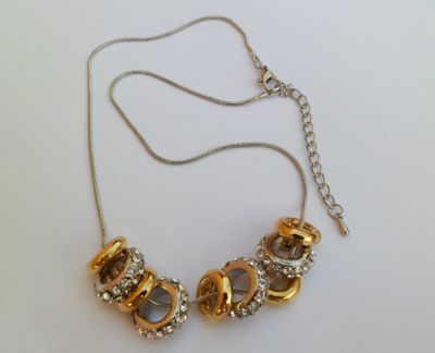 Necklace with silver and gold rings