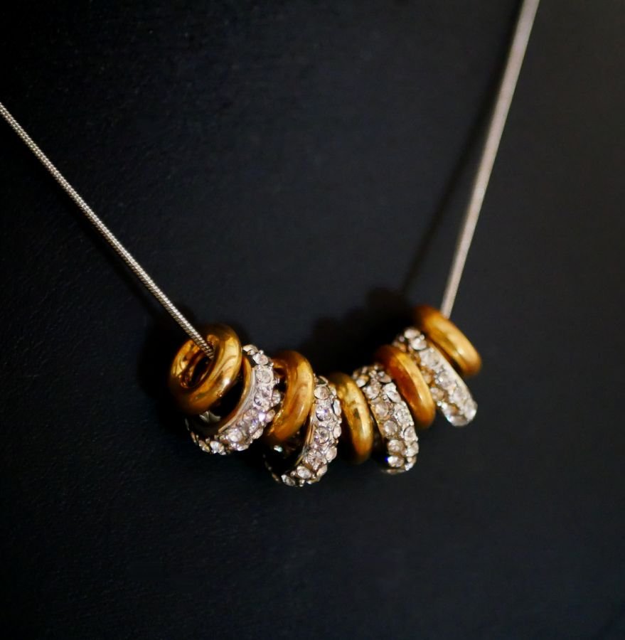 Necklace with silver and gold rings