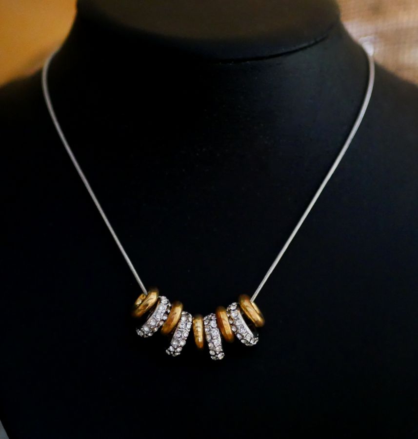 Necklace with silver and gold rings