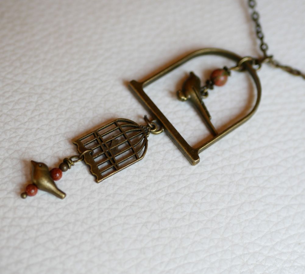 Necklace with long bird pendant