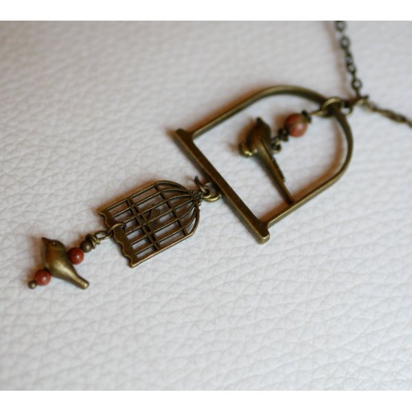 Necklace with long bird pendant