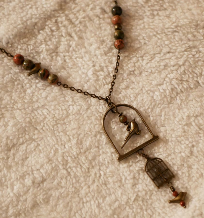 Necklace with long bird pendant