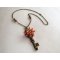 Pendant necklace Key and flowers in pearls on chain