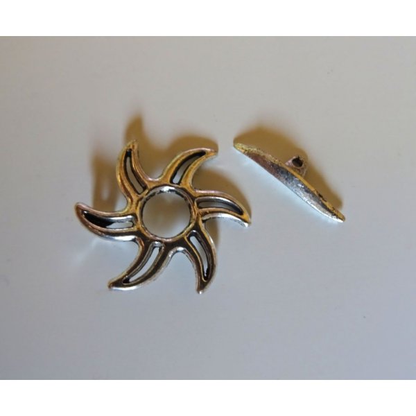 T-shaped clasp with aged silver sunburst