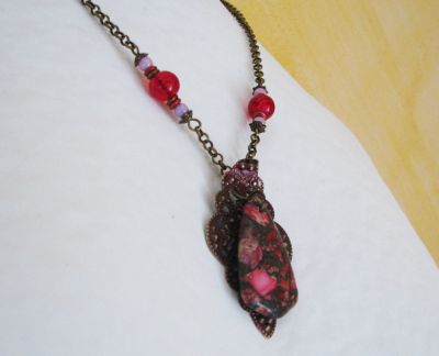 Fuchsia jasper pendant on patina print