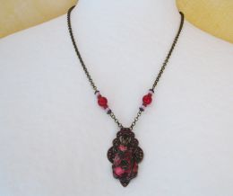 Fuchsia jasper pendant on patina print