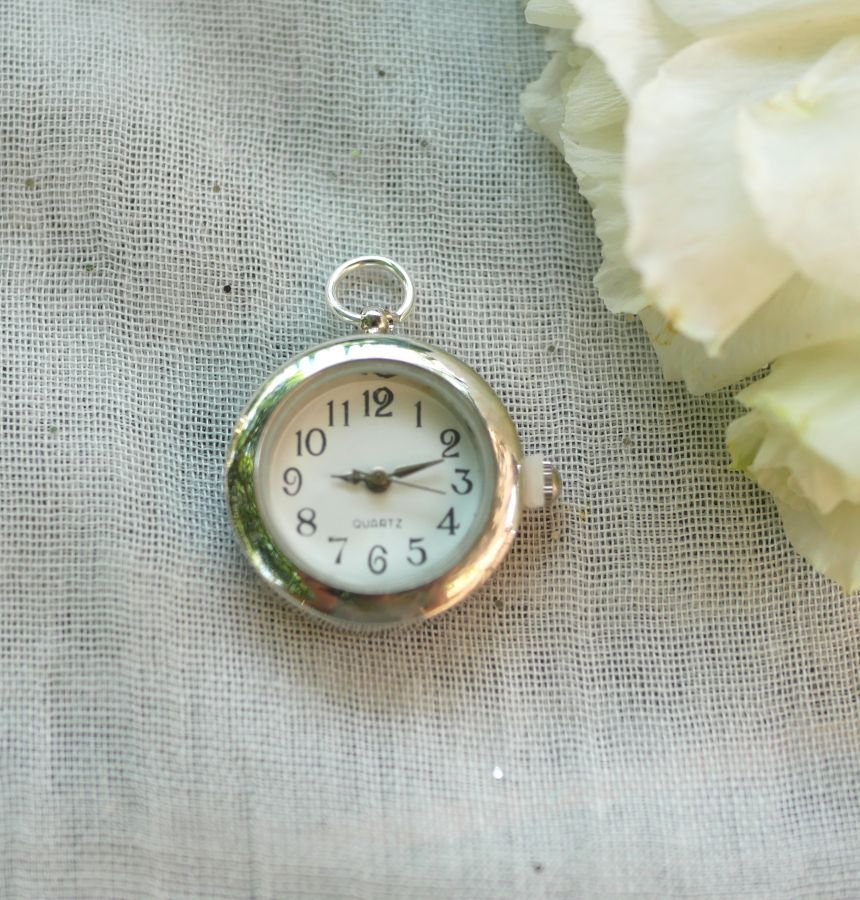 Pendant watch with round silver dial