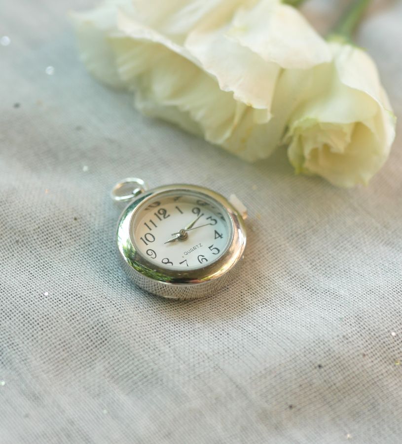 Pendant watch with round silver dial