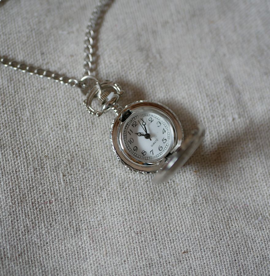 Round silver plated watch pendant on chain