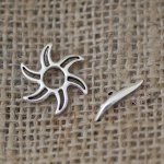 T-shaped clasp with aged silver sunburst