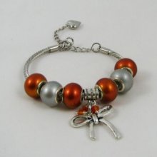 Silver bracelet with orange beads and knot