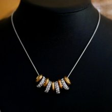 Necklace with silver and gold rings